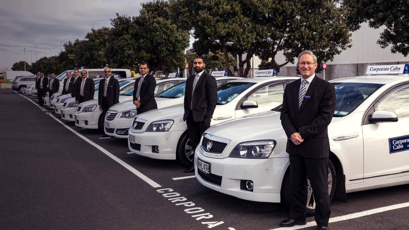 Corporate Cabs Drivers in a line next to their cars